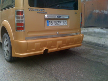 Задній бампер (накладка, під фарбування) для Ford Connect 2002-2006 рр