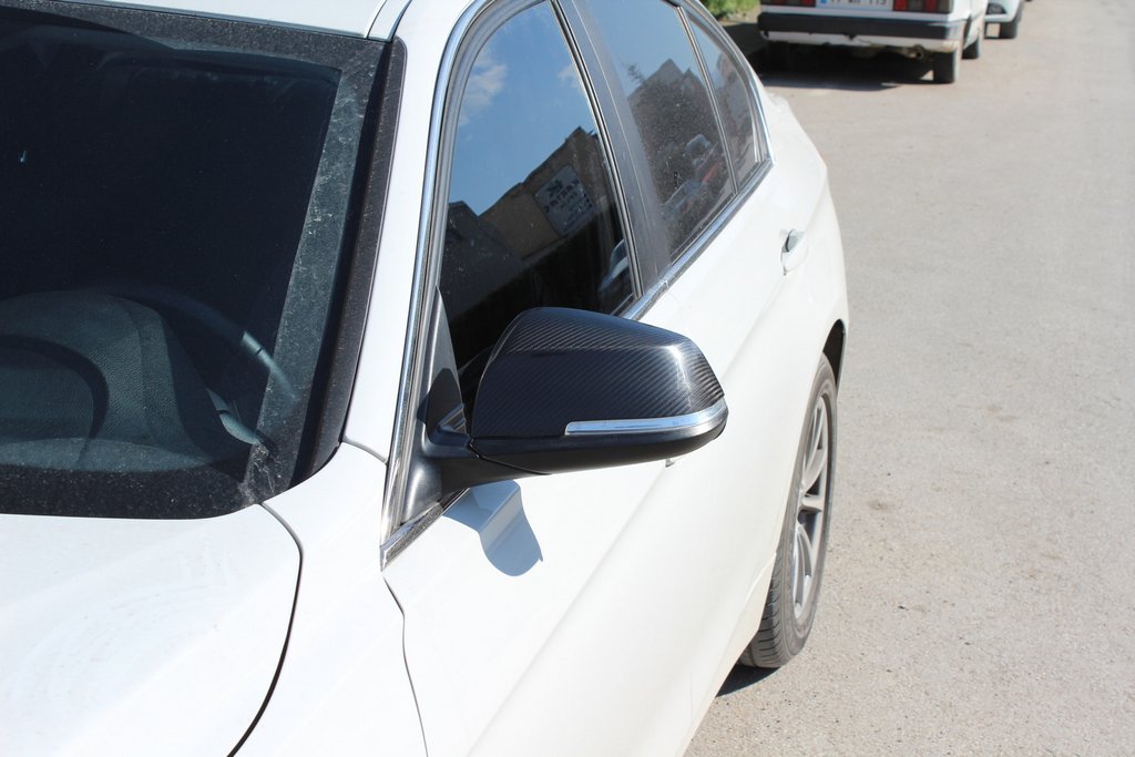 Накладки на дзеркала (2 шт, натуральний карбон) для BMW X1 E84 2009-2015 рр